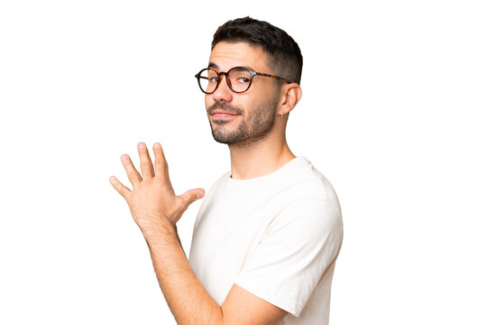 Young handsome caucasian man over isolated chroma key background scheming something