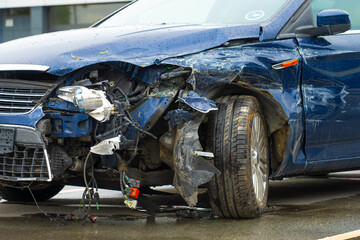 Severely damaged car after traffic accident scene.