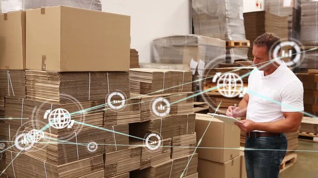 The warehouse worker is checking his list to make sure that all of the items are accounted for