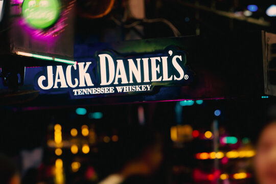 Phuket, Thailand, 29 11 2025 : Jack Daniels Tennessee Whiskey is an advertising sign on a night bar among advertising lights. Nightlife, hangouts and fun. High quality photo