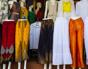Elegant mannequins displaying formal fashion in boutique doorway