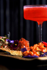 Assorted Salmon and Tuna Tartare Appetizers on Crispy Chips