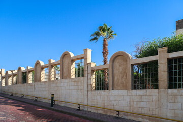 Beautiful stone fence along the road.