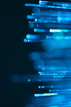 Blue optical fibers close up abstract background. Shallow depth field.