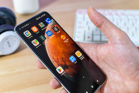 Beer Sheva, Israel. September 18, 2025: Male hand holding smartphone, Android Home Screen, Page 4