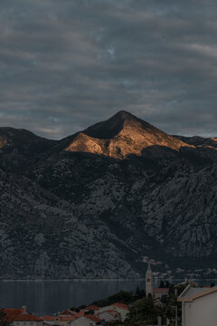 First touch of the light at sunrise along the town of Dobrota in Montenegro. 