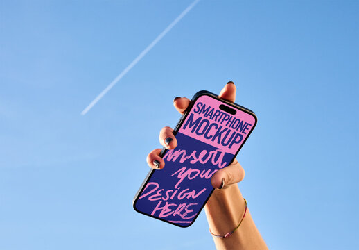 Mockup of real photo from Hand Holding Smartphone Against Blue Sky