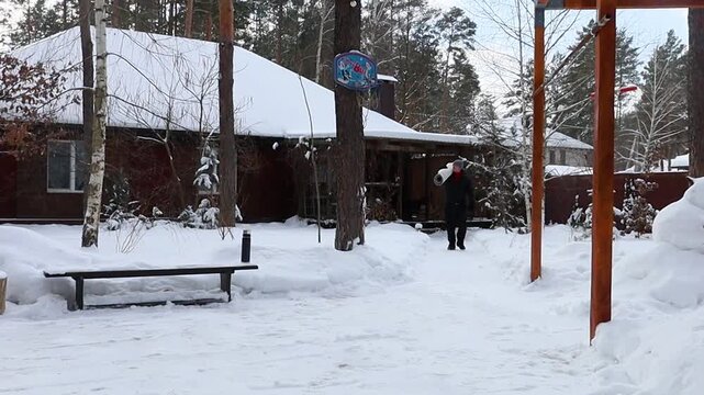 a man beats out and cleans a carpet