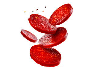 Spanish chorizo sausage slices in the air, cut out