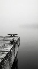 Fototapeta premium Empty wooden dock planks facing a misty lake. Atmospheric background for outdoor product presentation.