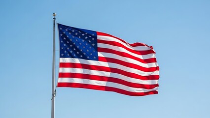 A vibrant US flag on a pole, waving against a clear, bright, blue sky, symbolizing freedom