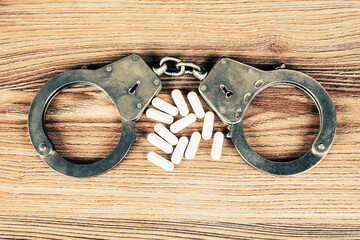 Pills with a Handcuffs closeup