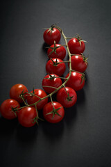 pretty branch of red cherry tomatoes