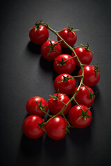 pretty branch of red cherry tomatoes