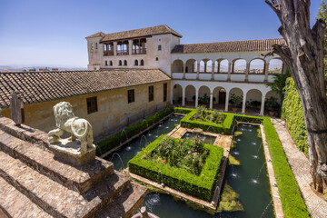 Alhambra Generalife gardens with lion statue, Granada, Spain