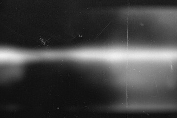 retro film overlay effect with scratch dust and bokeh light leaks,retro grain noisy film distressed light leak flare on black background,black and white abstract background,Abstract old film texture © PT-studio