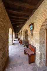 Fototapeta premium Long medieval cloister gallery with brick arches in Oropesa