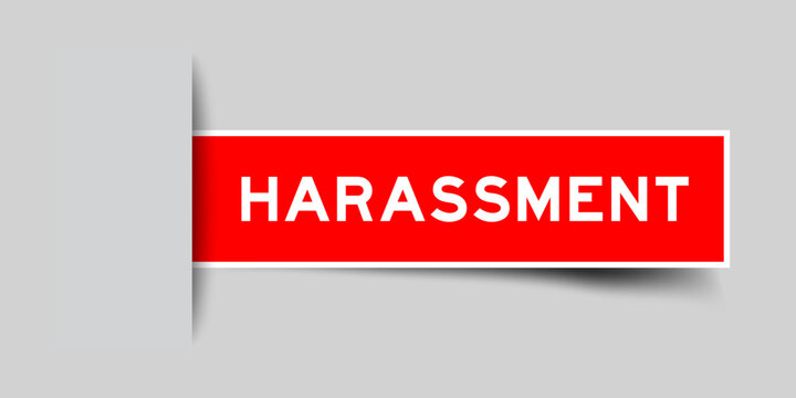 Red color square shape sticker label with word harassment inserted in gray background