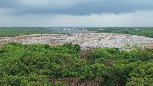 Revealing a massive bali landfill encroaching on green forest