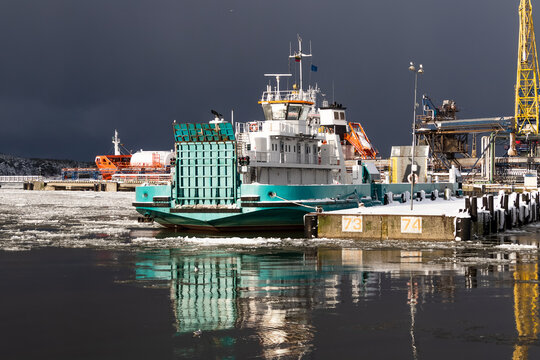 Container ships and passenger ferries docked at Klaipeda&mdash;da Port at night in winter, Lithuania