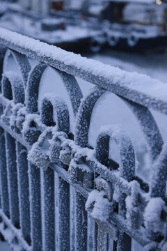 Close-up of metal locks on a metal gate covered in ice and snow on a winter day, Murmansk, Murmansk Oblast, Russia