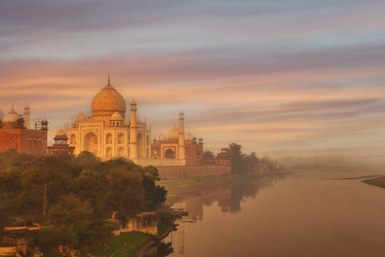 Taj Mahal on the banks of the Jamuna river at sunrise, Agra, Uttar Pradesh, India