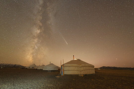 Milky Way over a row of Mongolian yurts in the Gobi Desert, Western Mongolia, Mongolia