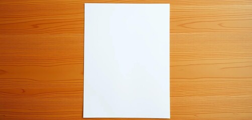 A single sheet of white printer paper lies flat on a wooden surface,  pure,  wood