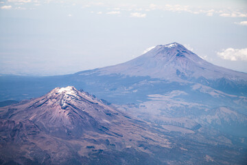 Aerial view of Iztaccihuatl and Popocatepetl volcanoes in Mexico © Lili Palet
