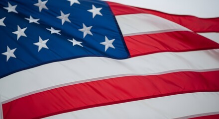 The American flag waving in the wind with stars and stripes