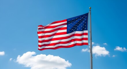 Fototapeta premium The American flag waving in the wind on a sunny day