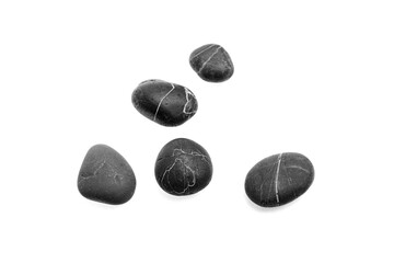 Fototapeta premium Black pebble stones with white veins arranged on a white background, showcasing smooth textures and natural shapes, ideal for decorative or landscaping purposes