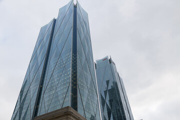Naklejka premium skyward view of CIBC Square on a cloudy winter day in Toronto (seen from corner of Bay St and Front St W)