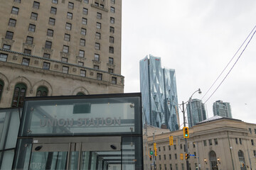 Naklejka premium entrance to Union Station from intersection of University Av, York St, and Front St W, Toronto (with view of historic Royal York, CIBC Square, and condo towers)