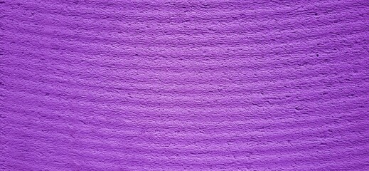 Fototapeta premium A vibrant purple surface, streaked with horizontal lines like silent pulses. This texture evokes both raw material and abstract elegance, perfect for artistic.