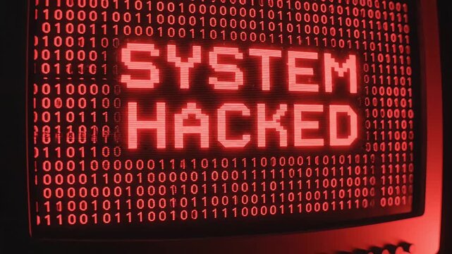 Hacked computer screen with binary code and warning message