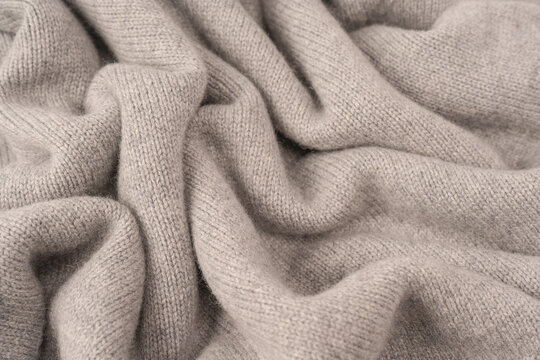 Soft grey merino wool sweater texture as a background.
