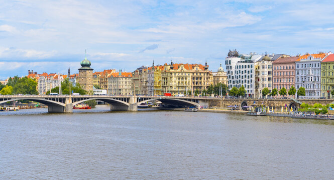 Prague panorama with the Dancing House,Sitkov water tower and Jirasek Bridge over the Vltava river in Prague, Czech Republic.