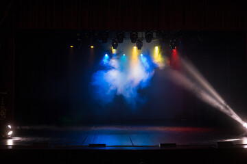 Fototapeta premium stage light with colored spotlights and smoke, concert and theatre scene 