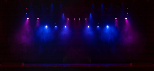 Obraz premium scene, stage light with colored spotlights and smoke