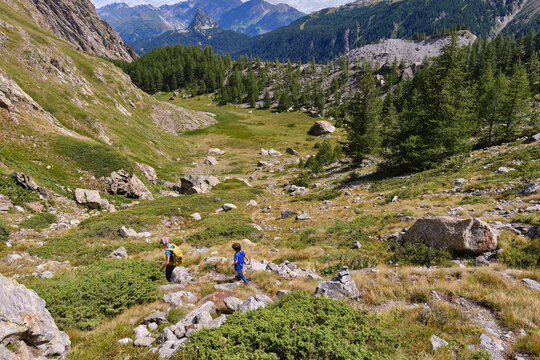 Hiking family in the Italian Alps