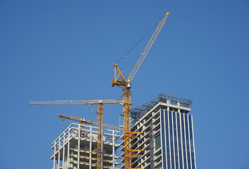 Construction of high-rise buildings in City, industrial construction site © xiaoliangge