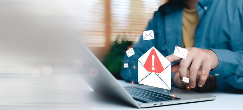 Phishing email warning alert on laptop screen with suspicious message icons, representing online scam, email fraud, cyber security risk, data breach threat, hacking attempt, digital safety concept. - Powered by Adobe