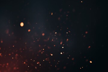 Glowing embers against a dark background creating a dramatic atmosphere