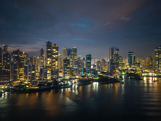 Obraz premium Panama City skyline at night with illuminated skyscrapers 