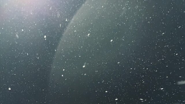 Closeup Snowflakes Against Bright Light Source At Night, Detailed Crystalline Flakes And Soft Bokeh Creating Delicate Patterns And Shimmering Halos, Ethereal Cold Atmosphere With Subtle.