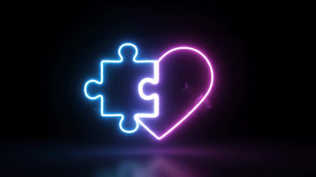Glowing Neon Heart Puzzle Piece - A neon puzzle piece and heart shape are illuminated against a black background. The puzzle piece glows blue and the heart glows pink, with a subtle reflection below.