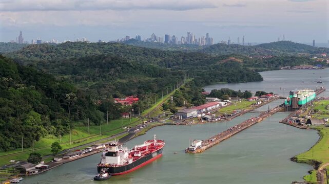 Panama Canal locks aerial panning drone video with cargo ship