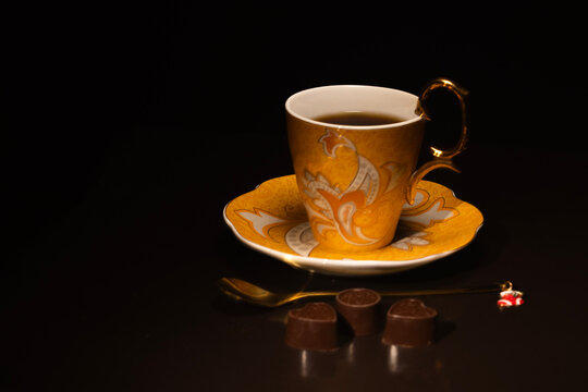 cup of coffee on black background