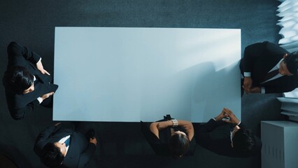 Top view of business team discuss about marketing strategy while project manager enter meeting and talking about plan. Diverse people brainstorming idea while businesswoman join meeting. Directorate.